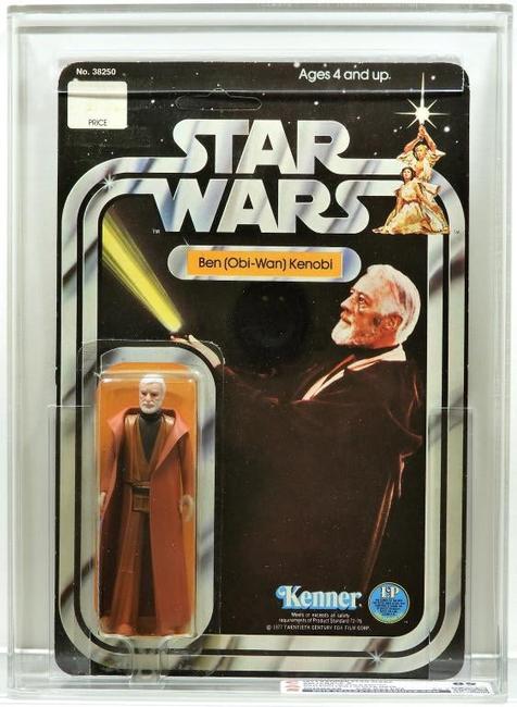 Lot 6: 1977 Kenner Star Wars 12 Back Ben Obi-Wan Kenobi card, unpunched, the figure a white hair variant, SKU number of footer card, graded CAS 85 (est.  $1,000-$1,500).  