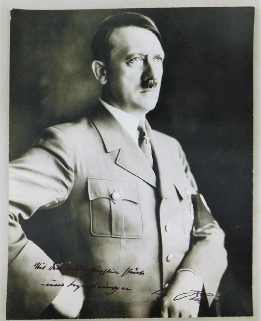 Photo of German leader Adolph Hitler, signed by him with a sentiment, circa 1933-1939, taken by Heinrich Hoffman, Hitler's official photographer ($1,750).