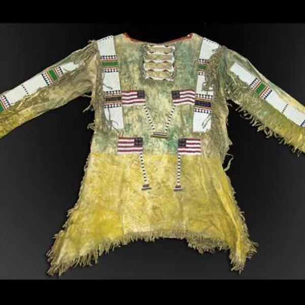 The top lot of the auction was this late 1800s sinew sewn hide Sioux war shirt with lazy stitch beading that sold for $27,500.