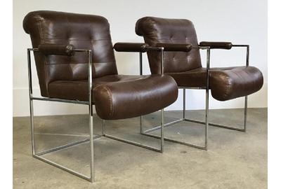 A pair of Milo Baughman for Thayer Coggin Thin Line chrome armchairs was designed in a dark brown vinyl upholstery mimicking leather, 32 by 23 by 29 inches ($300-600).  