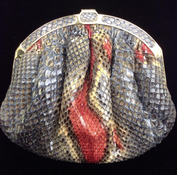 A snakeskin luxury handbag, marked for Florence Manelli, handmade in Italy, with detachable shoulder strap, will cross the block.