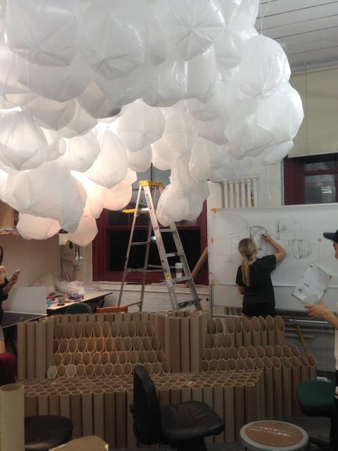 A Pratt design student preparing "Cloudspace," one of two visitor lounges for the METRO Show.