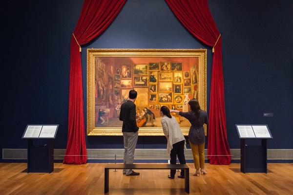 Phil Archer, curator at Reynolda House Museum of American Art, shows visitors Samuel Morse’s painting Gallery of the Louvre, now on view at the museum through June 4.  Early prototypes of Morse’s other masterwork – the telegraph - are also exhibited.  