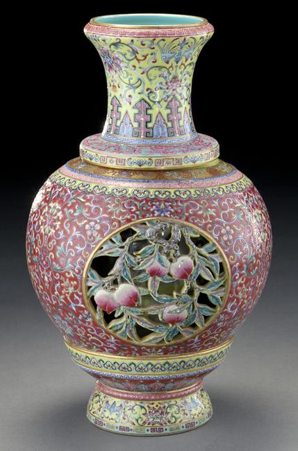 Lot 223 and lot 240, two Impressive Chinese Republic revolving and reticulated porcelain vase within a vase, the openwork finely painted to depict peaches and scrolling lotus, the interior depicting figures reading scrolls and playing games sold for $110,250.00 with an estimates of $8,000-$12,000.00.