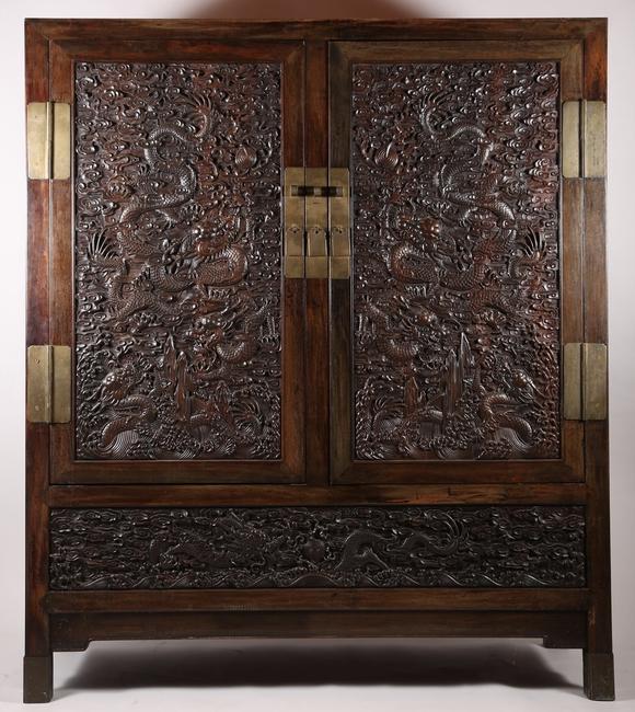 A Large Zitan Dragon Carved Cabinet, dating to the middle Qing period