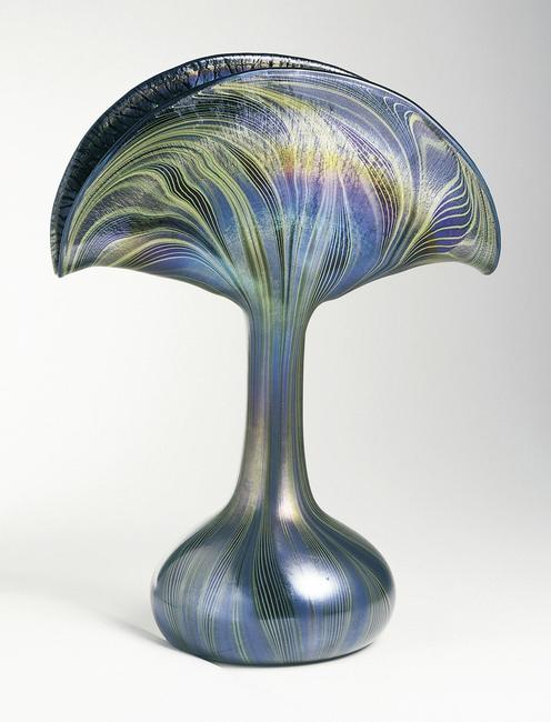 Peacock Vase Vase, ca.  1901; Produced by Tiffany and Co.  (United States); USA; mold-blown and iridized glass; H x W x D: 33.7 x 25 x 14 cm (13 1/4 x 9 13/16 x 5 1/2 in.); Gift of Stanley Siegel, from the Stanley Siegel Collection; 1975-32-11; Cooper Hewitt, Smithsonian Design Museum.  