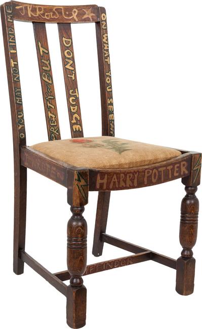 Part of Heritage Auction’s Rare Books auction in New York, April 6, 2016, this chair is painted in J.K.  Rowling’s hand: “I wrote Harry Potter while sitting on this chair”