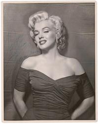 Black and white photograph of Marilyn Monroe signed and inscribed “to Joe” (possibly Joe DiMaggio), unusually large at 11 inches by 14 inches (est.  $20,000-$25,000).