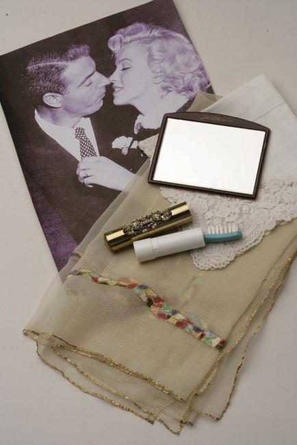 A mirror from Sakes Fifth Avenue and other personal items Monroe carried in her purse the day she married DiMaggio.  