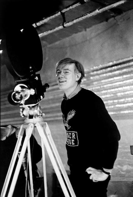 Andy Warhol at the Silver Factory with his first sophisticated anchored camera.  New York, USA, 1964.  © Magnum Photo