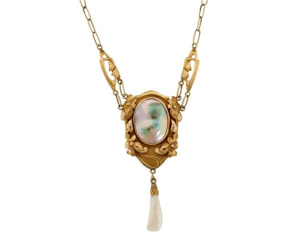 Kalo Shop pendant necklace of 14K yellow gold, blister pearl and dog tooth pearl, sold for $20,000 against an estimate of $5/7,000.