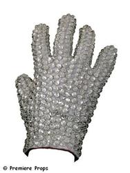 Actual glove worn on-stage by Michael Jackson during his “Victory” tour, a large white “tux-style” glove covered in crystals – palm front and back and all the fingers.  (est.  $50,000-$60,000).