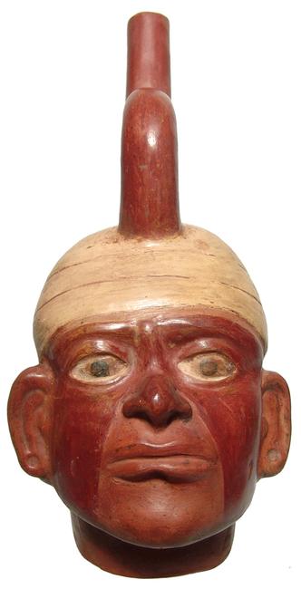 Lovely Moche portrait vessel made between 100 BC and 500 AD, 11 ½ inches tall, depicting a male with well-modeled features and a wrapped headdress (est.  $600-$800).