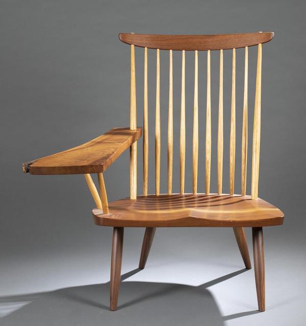 Nakashima lounge chair with free right arm, hickory spindles and a sap walnut seat, signed and dated (2000) beneath the seat, estimate $4,000-$6,000.  