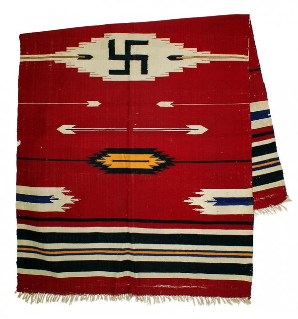 This late 19th century red weave Navajo blanket with swastika design, 39 inches by 64 inches, carries a minimum bid of $500.