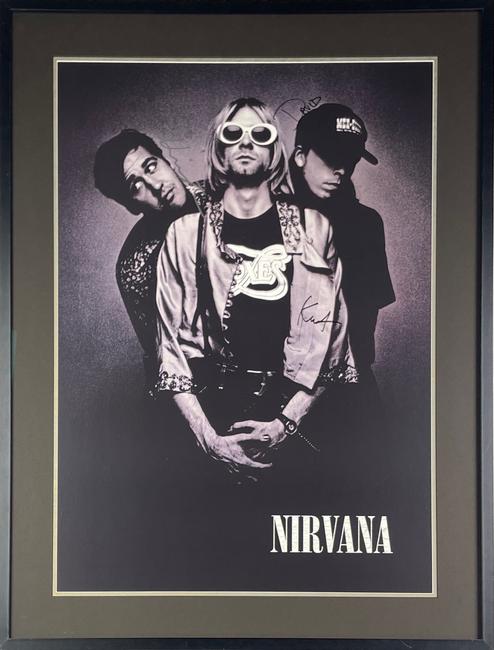 Rare 1993 Nirvana promotional poster, signed by the full band – Kurt Cobain, Krist Novoselic and Dave Grohl, for Nirvana’s third and final studio album, In Utero, released in Sept.  1993.  