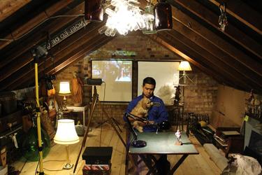 Noel Ed De Leon in his attic.  (c) noeleddeleon archives.  Photo courtesy, Godwin De Leon, London 2020