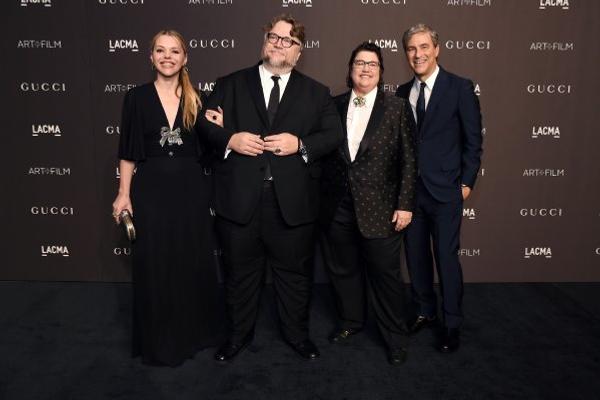 Writer Kim Morgan; honoree Guillermo del Toro, wearing Gucci; honoree Catherine Opie, wearing Gucci; and LACMA CEO and Wallis Annenberg Director Michael Govan, wearing Gucci; attend 2018 LACMA Art + Film Gala 