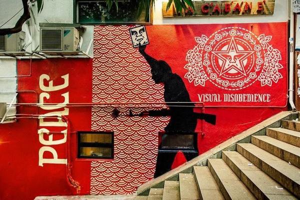 Shepard Fairey, part of the exhibition 'Visual Disobedience,' public mural, Hong Kong.