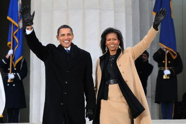 President-elect Barack Obama and Michelle Obama wave to the crowd gathered at the Lincoln Memorial on the National Mall in Washington, D.C., Jan.  18, 2009