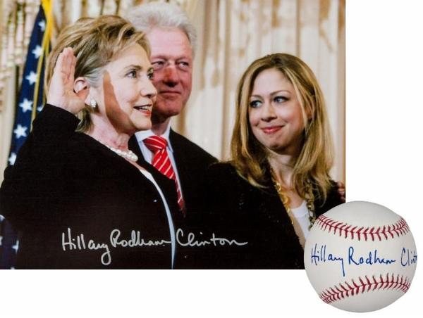 Hillary Clinton - Lot #1661 signed photo of her being sworn in as Secretary of State and an autographed baseball