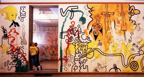 Keith Haring at Cranbrook Art Museum, 1987.  Photograph by Tseng Kwong Chi, 1987 © Muna Tseng Dance Projects, New York.  Artwork: © Keith Haring Foundation, New York.  