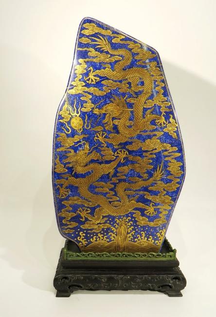 Chinese naturally shaped and carved stone, lavishly decorated in gold on lapis lazuli, 17 inches tall.