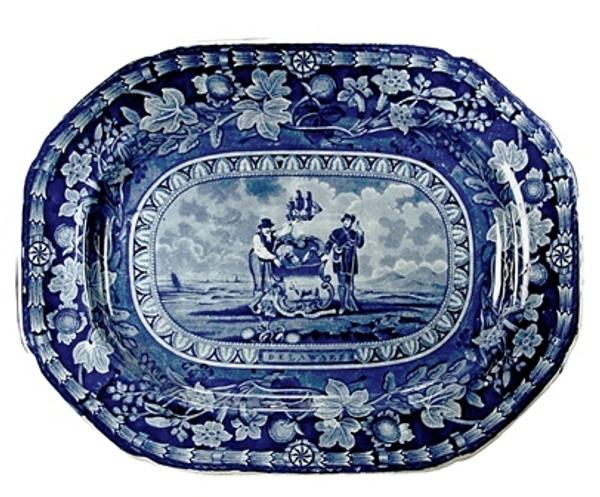 Platter, earthenware with blue printed design depicting the Arms of the State of Delaware, made by Thomas Mayer, Staffordshire, 1826-30, l.16½ in, w.  13 in.  Courtesy Winterthur Museum.  Bequest of Henry Francis du Pont.  1958.1847.  