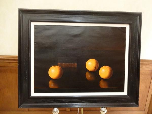 This vibrant still-life rendering of oranges and a book on a table is one of many artworks that is up for bid.  The online-only auction ends September 22nd.