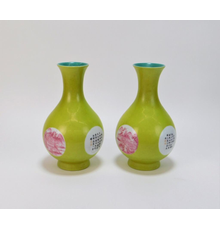 Pair of Chinese Qing Dynasty chartreuse raspberry porcelain vases, both 9 inches tall and each one decorated with two calligraphy cartouches and two landscape panels (est.  $1,000-$2,000).