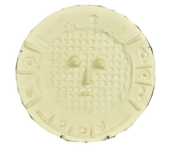 Ceramic charger by Pablo Picasso for Madoura in 1956, titled Visage a la Grille, 16 ½ inches in diameter, #50 of 100, stamped on verso “Empreinte Originale de Picasso” (est.  $3,000-$5,000).