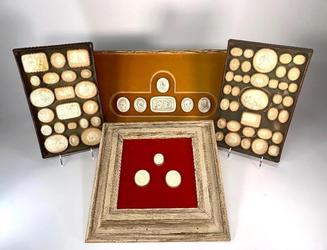 Group of Grand Tour plaster intaglios, consisting of two antique wood trays fitted with numbered intaglios, plus framed groupings of three and (later) six intaglios (est.  $500-$800).