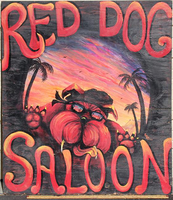 Original oil on board sign for the world-famous Red Dog Saloon in Virginia City, Nevada, dated 2003, signed by the artist “Miss Kitty”, 43 ½ inches by 48 inches, no frame (est.  $1,000-$2,500).