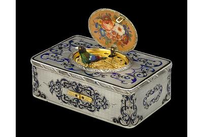 Frères Rochat crafted this rare, early Swiss singing bird box with the desirable fusée movement, housed in an elegant engraved silver and hand-enameled case.  Circa 1840.