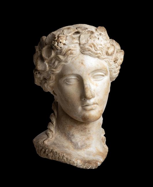 Life-size Roman marble head of Dionysos, after an early 4th century BC late Classical Greek archetype, dating to the Roman Imperial, Hadrianic period (est.  $50,000-$80,000).  