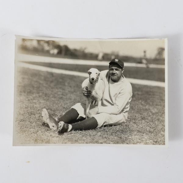 Babe Ruth pictured with a greyhound dog Hazel, who belonged to the very Midwestern family that compiled the photo album discovered in the storage facility.