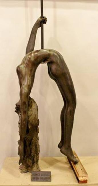 This bronze sculpture of a female trapeze artist by Victor Salmones will be sold Oct.  6.