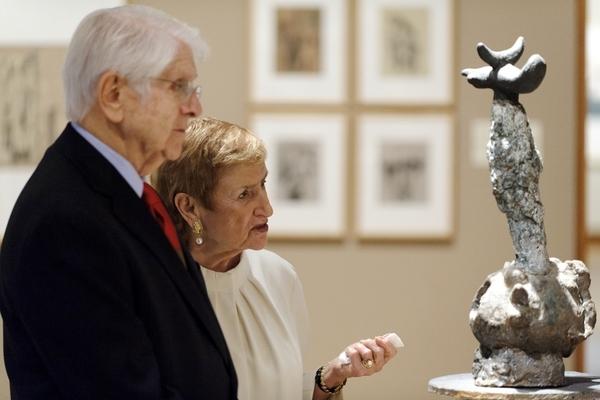 Donors Jerome and Simona Chazen study "Monument," a sculpture by Spanish artist Joan Miro, on display in a third-floor gallery at the Chazen Museum of Art during a 2011 open house for the museum’s expansion.