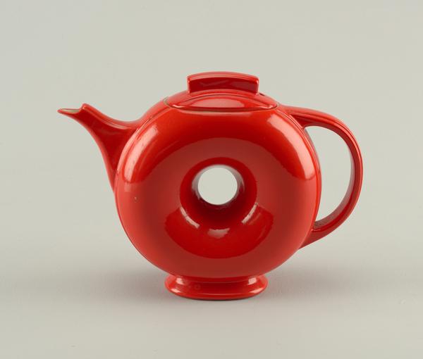 Doughnut Teapot And Lid, ca.  1940; Manufactured by Hall China Company (United States); USA; molded and glazed earthenware; Museum purchase from Decorative Arts Association Acquisition Fund; 1984-90-1-a,b.