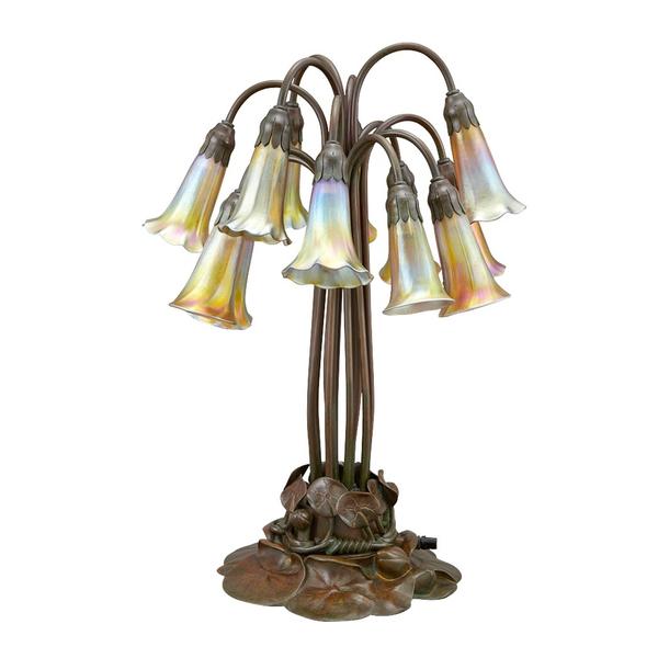 Tiffany Studios Bronze and Favrile Glass Twelve-Light Pond Lily Lamp, First quarter of the 20th century, height 21 inches.  From the Museum of Fine Arts, Boston.  Estimate: $20,000-30,000