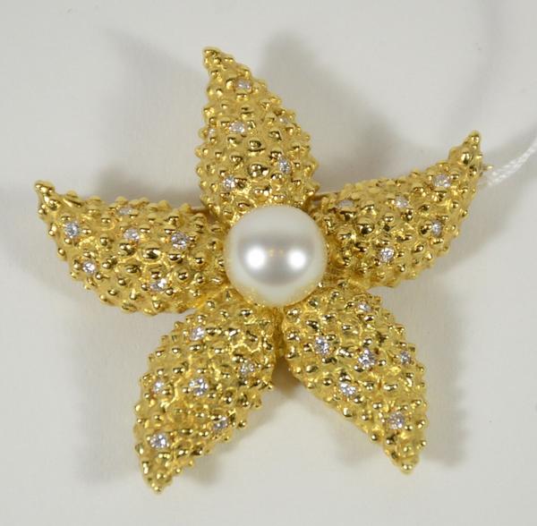 18kt yellow gold diamond and pearl starfish pin.