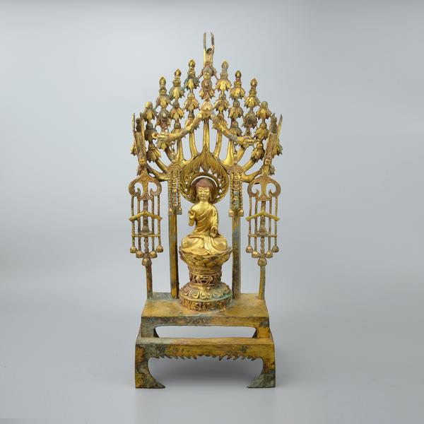 Sui Dynasty gilt-bronze altarpiece of Buddha Maitreya with seven Buddha on lotus blossom thrones.  Gianguan Auctions, March, 2018.