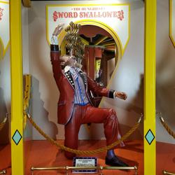 Sculpted, 65-inch-tall portrayal of sword-swallower Martin Henshaw, who could swallow 14 swords at once, with a sign (“The World’s Hungriest Sword Swallower”) (est.  $500-$1,000).