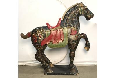 A Tang-style hand painted carved wooden horse statues will gallop across the block ($30/38,000).