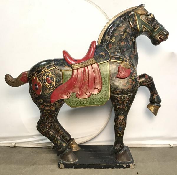 A Tang-style hand painted carved wooden horse statues will gallop across the block ($30/38,000).