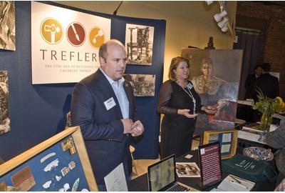 David Manzi, President of Trefler’s, and Janet Moran, Head Painting Conservator at Trefler’s, giving a booth talk on painting restoration.