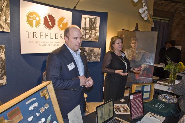 David Manzi, President of Trefler’s, and Janet Moran, Head Painting Conservator at Trefler’s, giving a booth talk on painting restoration.