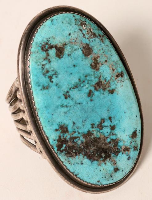 Indian cuff silver bracelet with a prominent Kingman turquoise stone, measuring 4 inches by 2 ¼ inches.  The sterling cuff was 6 inches.  The bracelet brought $2,250.