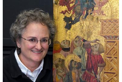 Photo: Chief Conservator and paintings conservator Serena Urry with the 600-year-old The Retablo of St.  Peter that she will be cleaning.Lorenzo Zaragoza (Spanish, b.Circa 1340, d.Circa 1410), Retablo of Saint Peter, Circa 1400, tempera, gold and silver on wood, The Edwin and Virginia Irwin Memorial, 1960.473