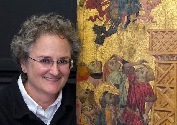 Photo: Chief Conservator and paintings conservator Serena Urry with the 600-year-old The Retablo of St.  Peter that she will be cleaning.Lorenzo Zaragoza (Spanish, b.Circa 1340, d.Circa 1410), Retablo of Saint Peter, Circa 1400, tempera, gold and silver on wood, The Edwin and Virginia Irwin Memorial, 1960.473